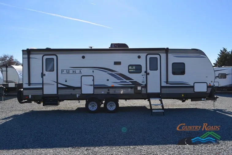 Side view of the New 2024 Palomino Puma 28DBFQ Travel Trailer RV.