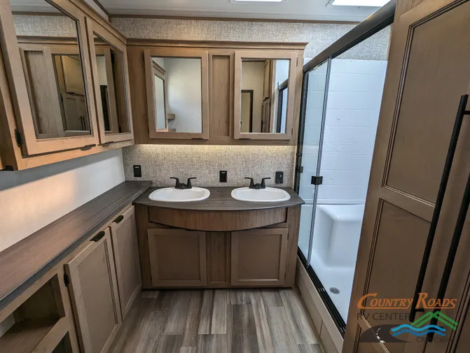 Bathroom with a sinks and a walk-in shower.