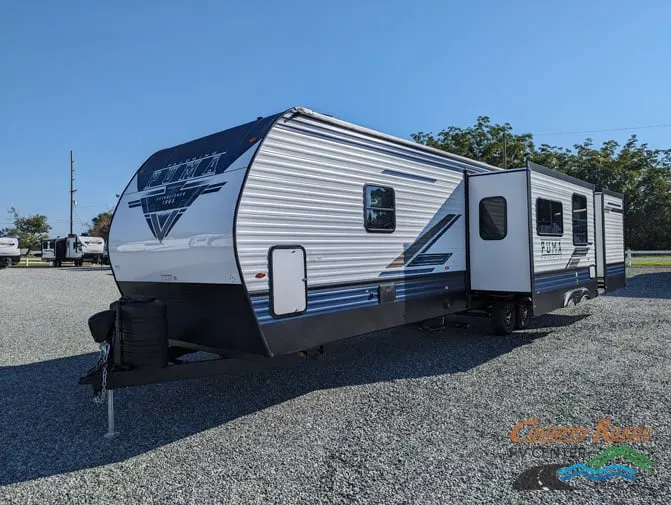 Side view of the New 2024 Palomino PUMA 32BHQS Travel Trailer RV.