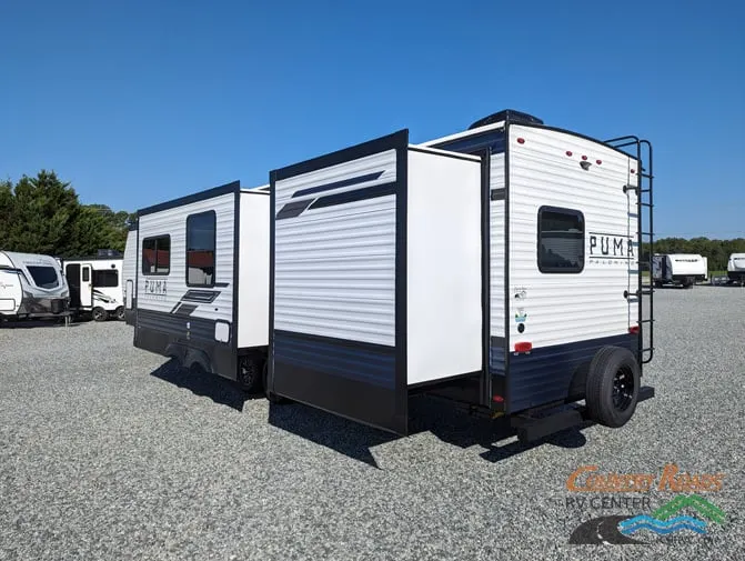 Side view of the New 2024 Palomino PUMA 32BHQS Travel Trailer RV.