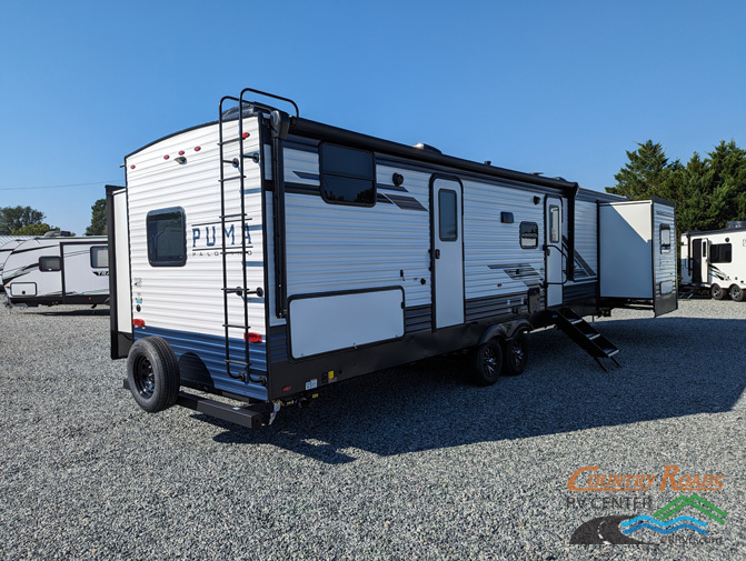 Side view of the New 2024 Palomino PUMA 32BHQS Travel Trailer RV.