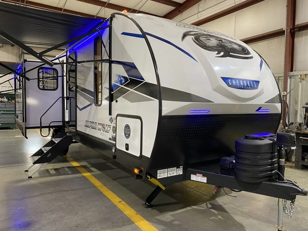 Side view of the New 2024 Forest River Alpha Wolf 26RL-L Travel Trailer RV.