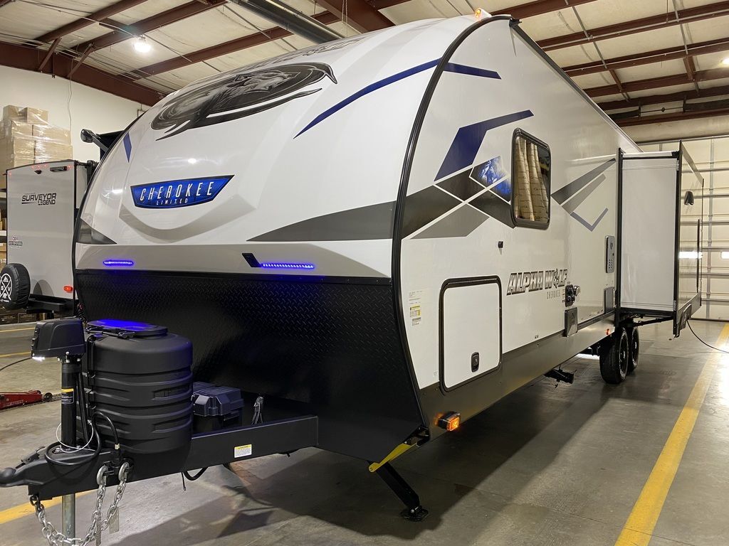 Side view of the New 2024 Forest River Alpha Wolf 26RL-L Travel Trailer RV.