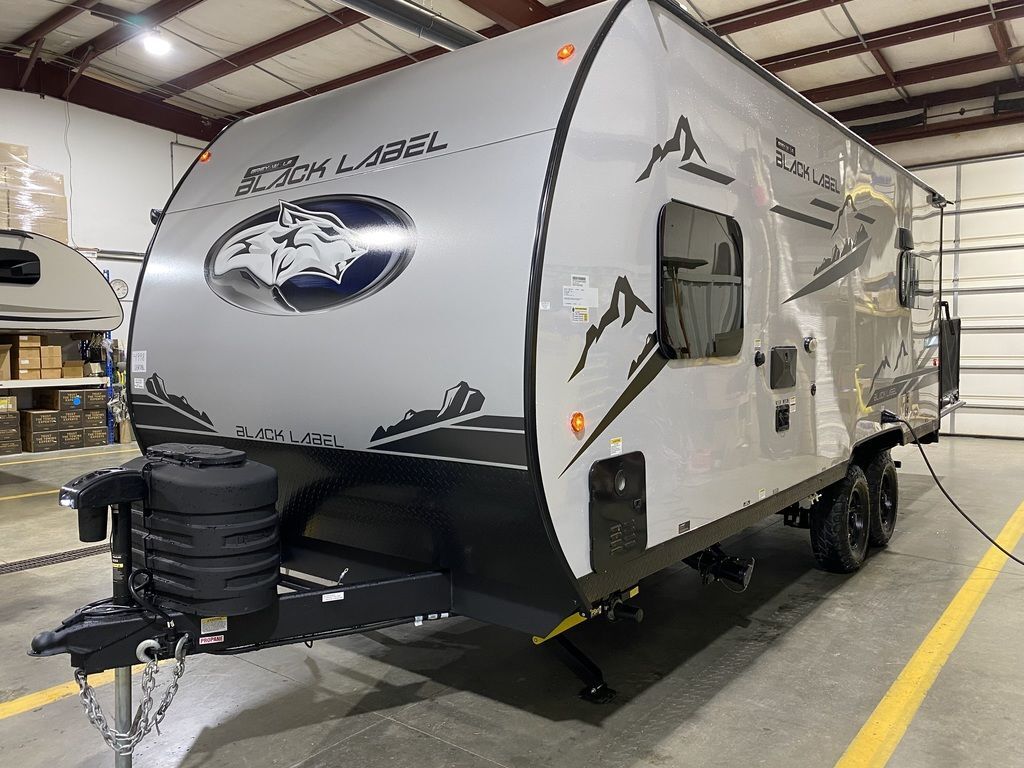 Side view of the New 2024 Forest River Cherokee Grey Wolf 18RR-BL Travel Trailer Toy Hauler RV.