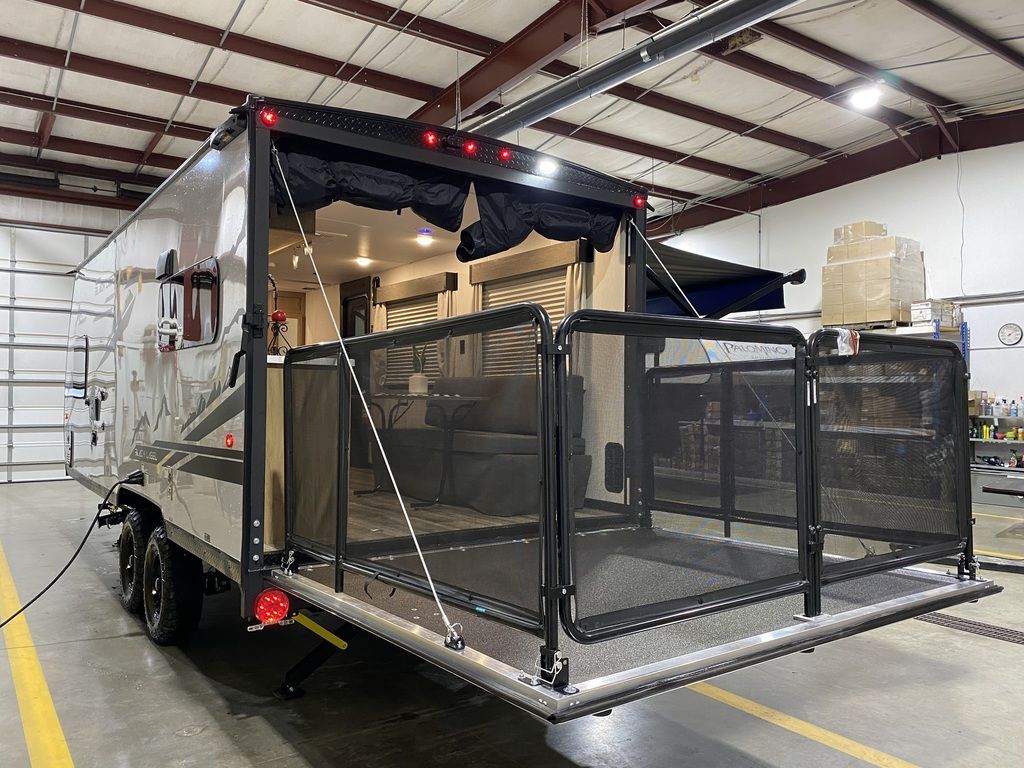 Rear view of the New 2024 Forest River Cherokee Grey Wolf 18RR-BL Travel Trailer Toy Hauler RV.