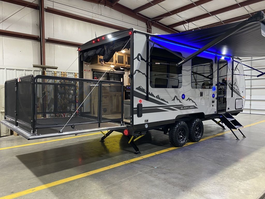 Side view of the New 2024 Forest River Cherokee Grey Wolf 18RR-BL Travel Trailer Toy Hauler RV.