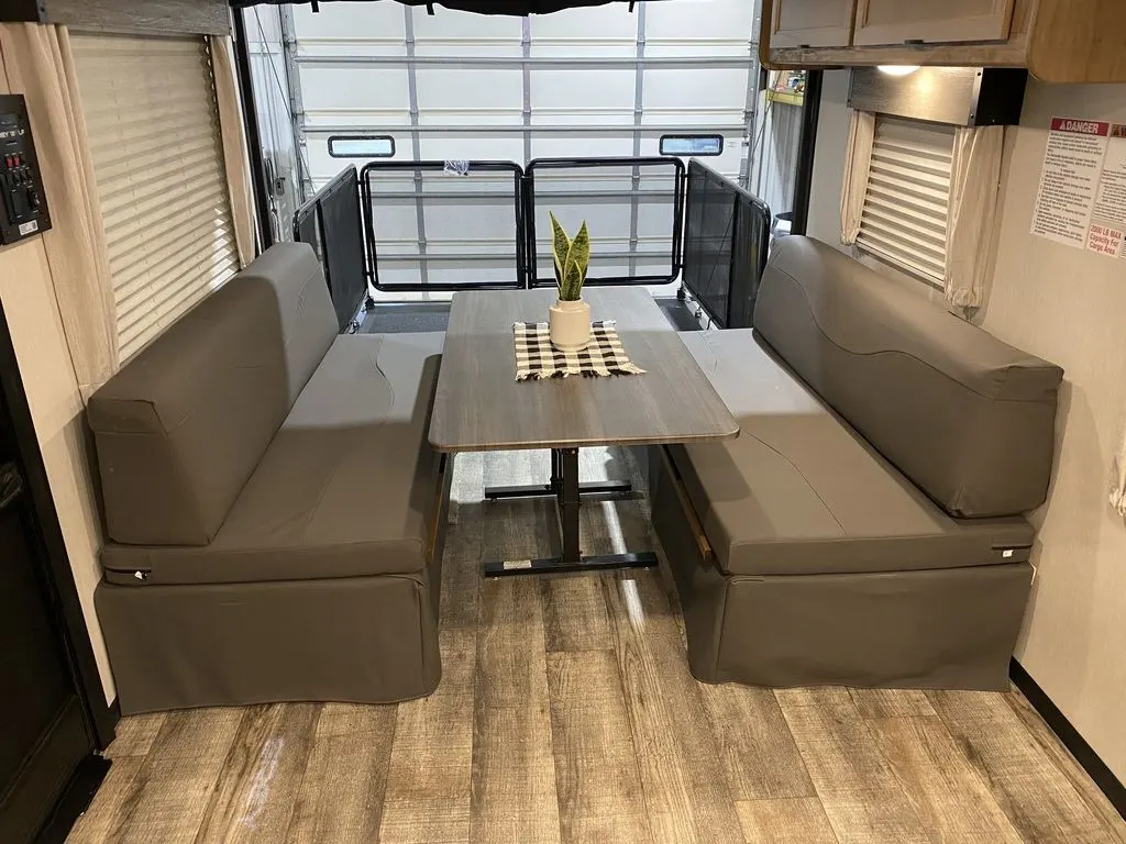 Dinette with overhead cabinets.