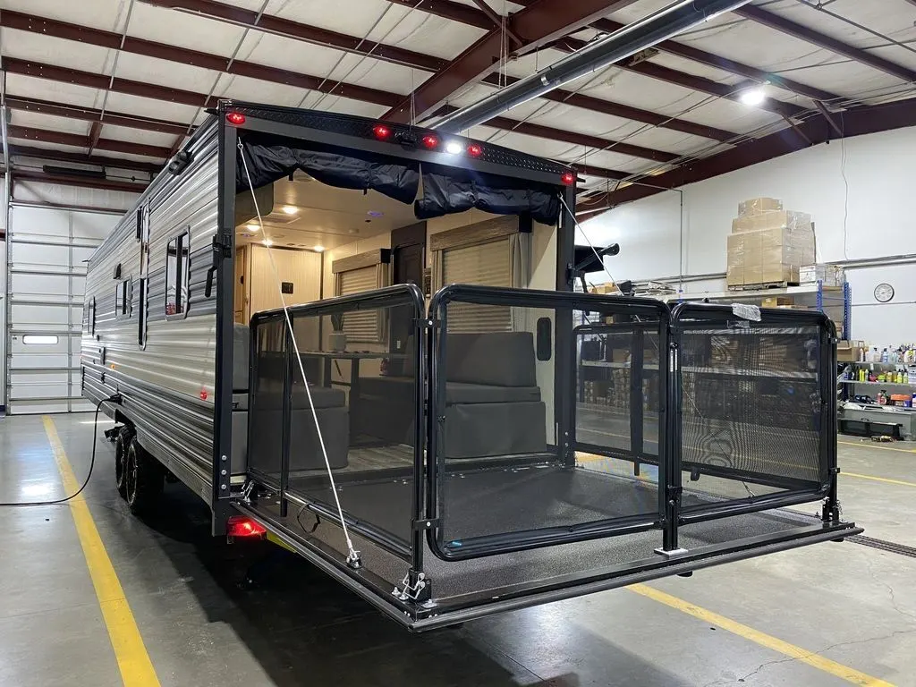 Rear view of the New 2024 Forest River Cherokee Grey Wolf 26MBRR Travel Trailer Toy Hauler RV.