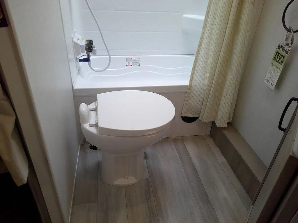 Bathroom with a toilet and a walk-in shower.