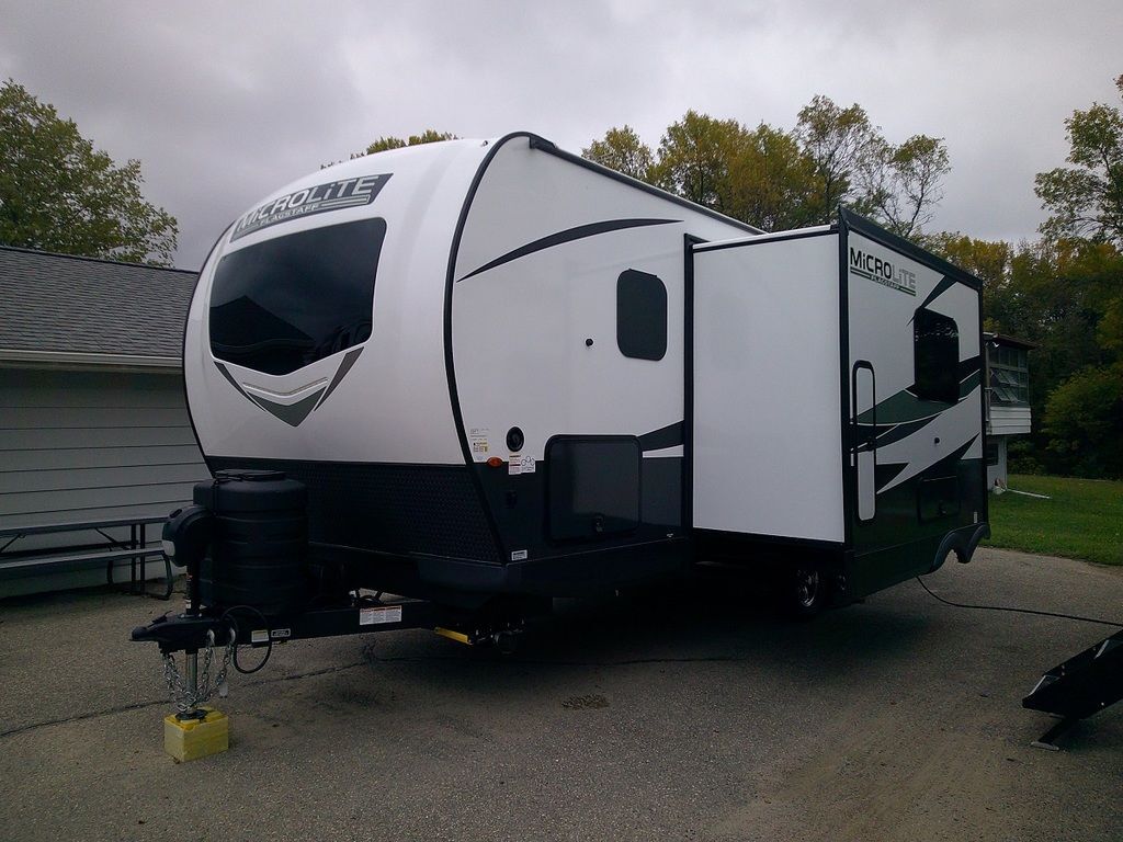 Side view of the New 2024 Forest River Flagstaff Micro Lite 25BRDS Travel Trailer RV.