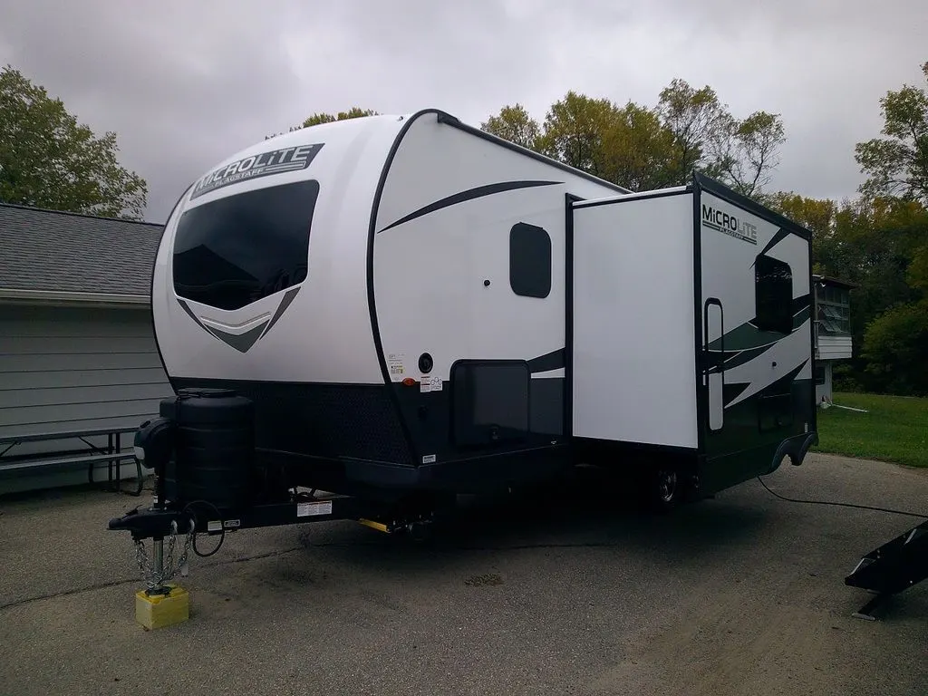 Side view of the New 2024 Forest River Flagstaff Micro Lite 25BRDS Travel Trailer RV.