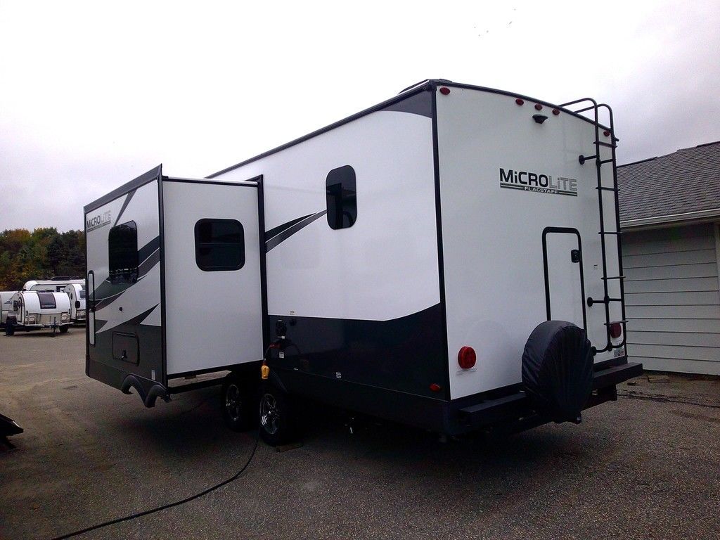 Side view of the New 2024 Forest River Flagstaff Micro Lite 25BRDS Travel Trailer RV.