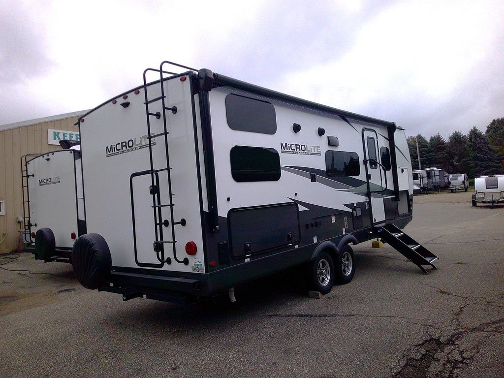 Side view of the New 2024 Forest River Flagstaff Micro Lite 25BRDS Travel Trailer RV.