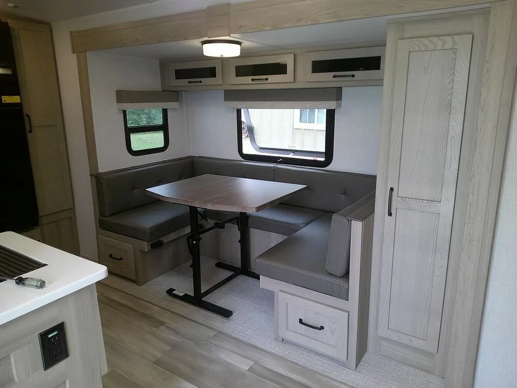 Dinette with overhead cabinets.