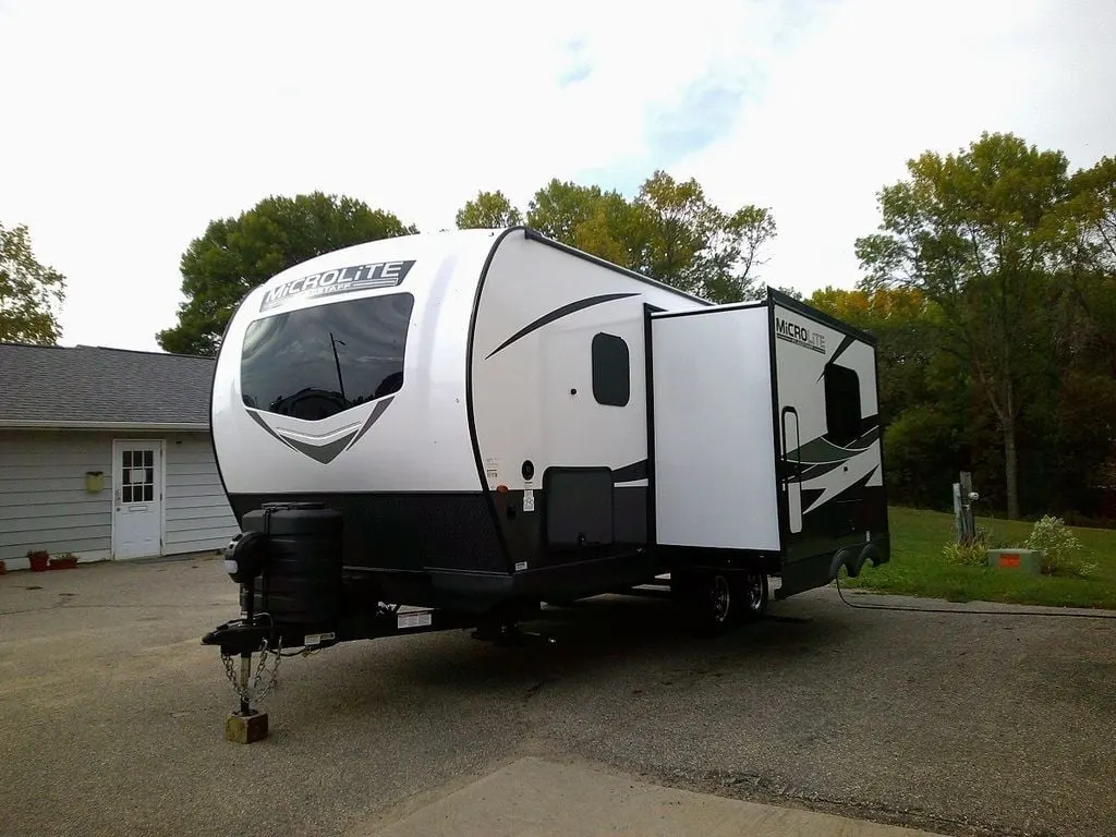 Side view of the New 2025 Forest River Flagstaff Micro Lite 22SQS Travel Trailer RV.