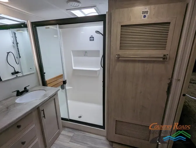 Bathroom with a sink and a walk-in shower.