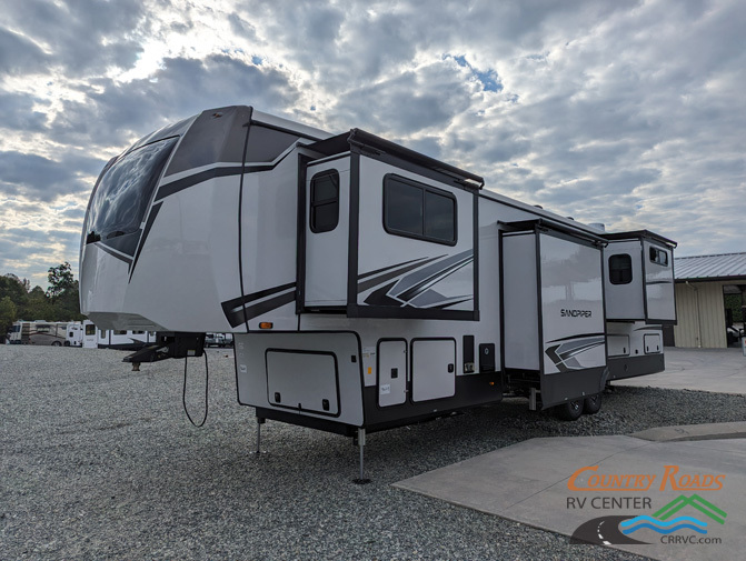 Side view of the New 2024 Forest River SANDPIPER 391FLRB Fifth Wheel RV.