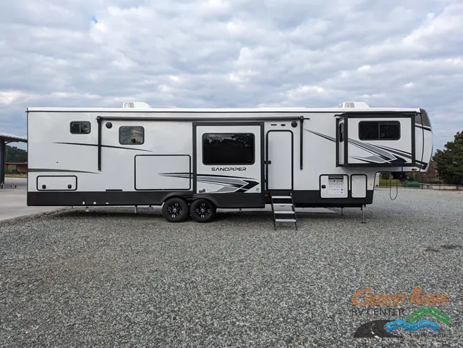 Side view of the New 2024 Forest River SANDPIPER 391FLRB Fifth Wheel RV.