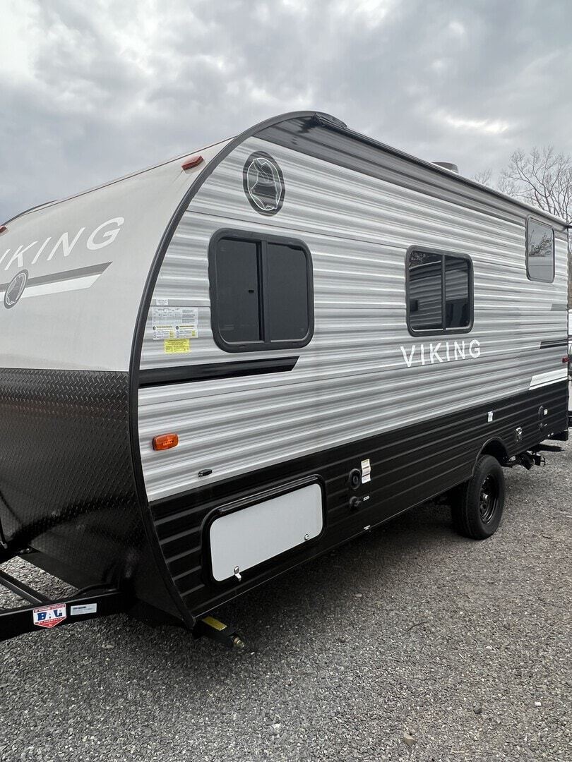 Side view of the New 2022 Coachmen Viking RVs 17FQ Travel Trailer RV.