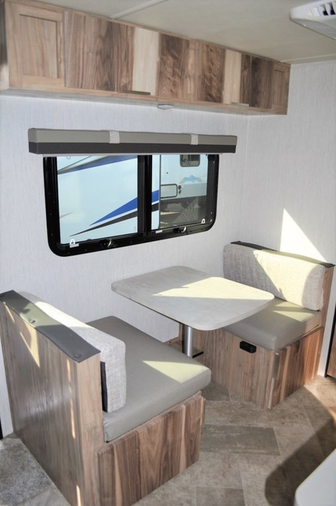 Dinette with overhead cabinets.