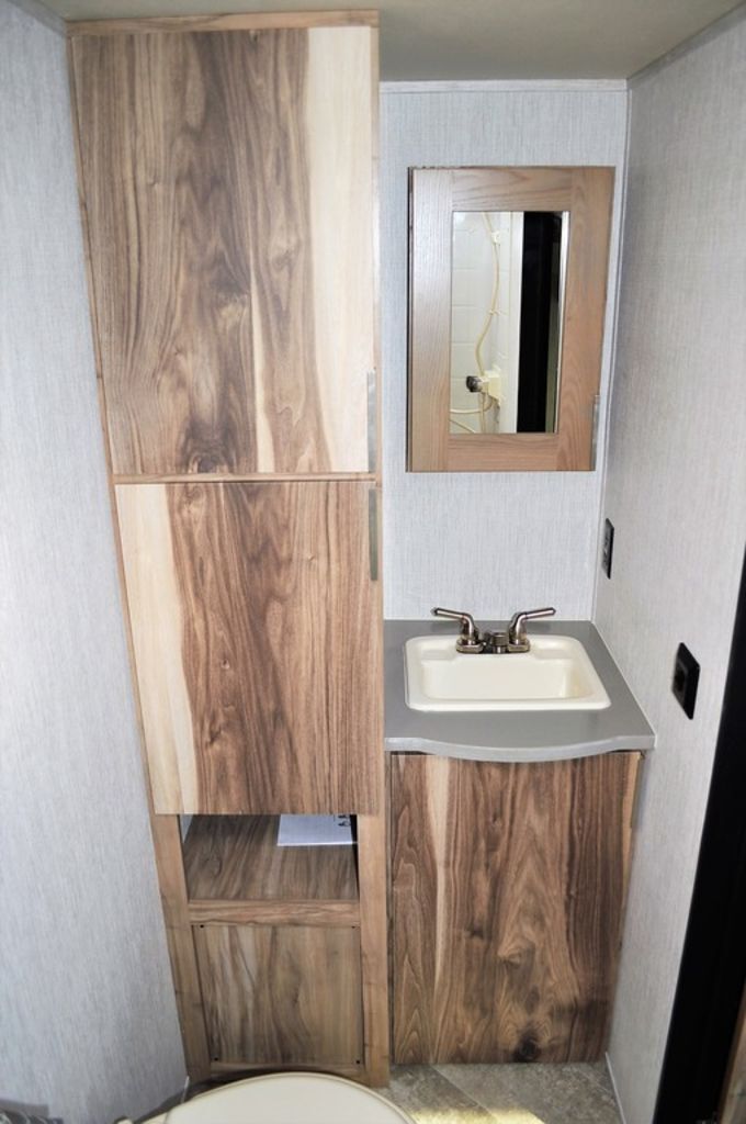 Bathroom with a sink, linen and a medicine cabinet.