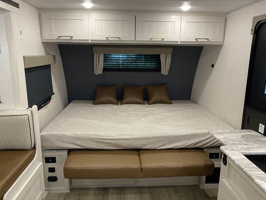 Bedroom with overhead cabinets.