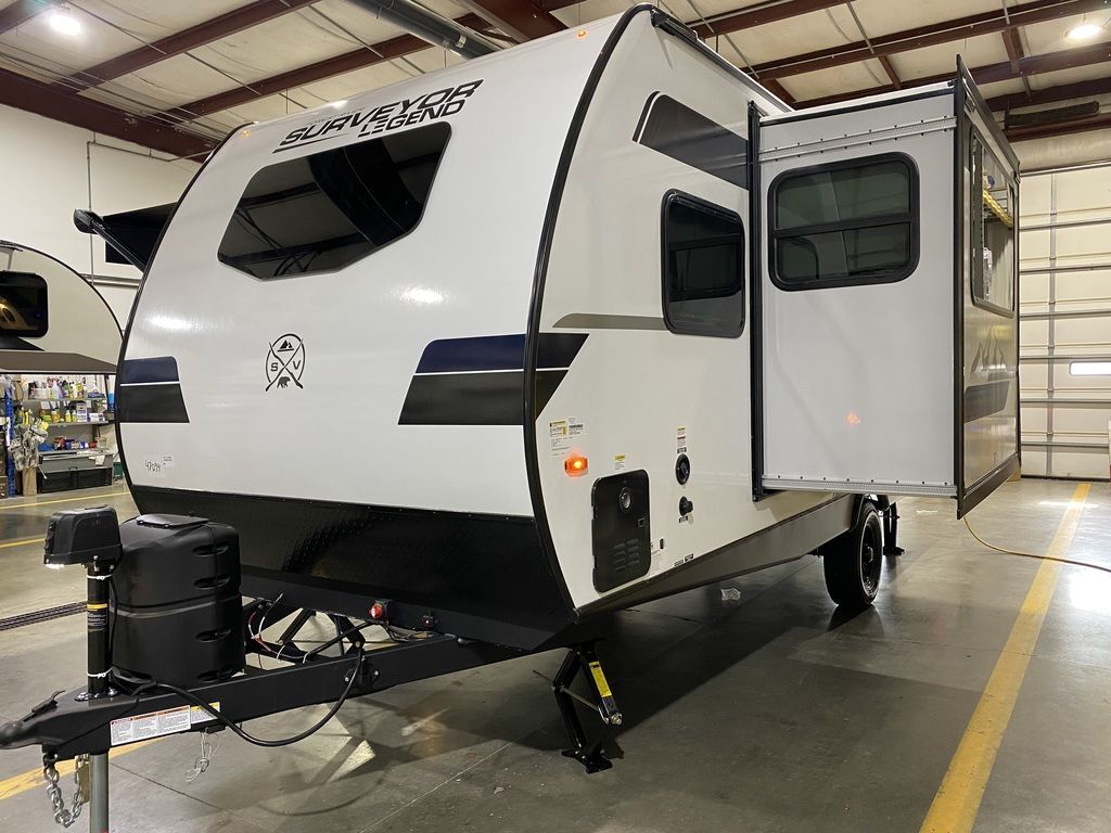 Side view of the New 2024 Forest River Surveyor Legend Sub 19MDBLE Travel Trailer RV.