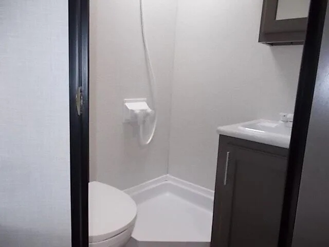 Bathroom with a toilet and a shower.