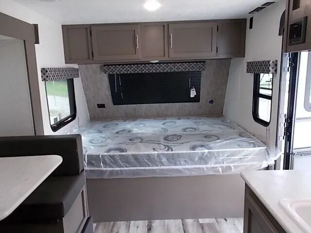 Bedroom with overhead cabinets.