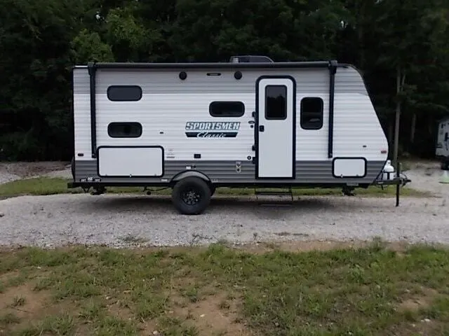 Side view of the New 2024 KZ RV Sportsmen Classic 191BHK Travel Trailer RV.