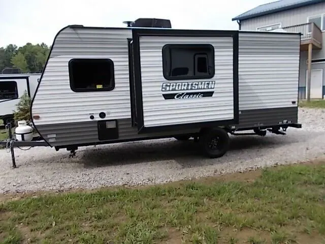 Side view of the New 2024 KZ RV Sportsmen Classic 191BHK Travel Trailer RV.