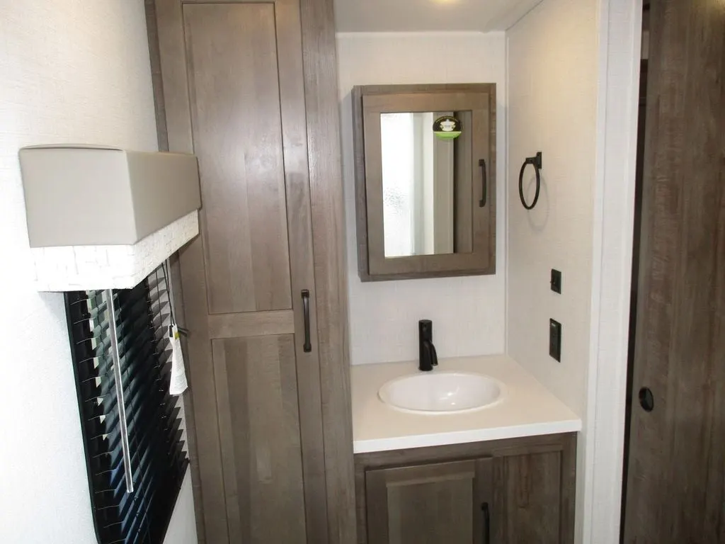 Bathroom with a sink, medicine cabinet and a linen.