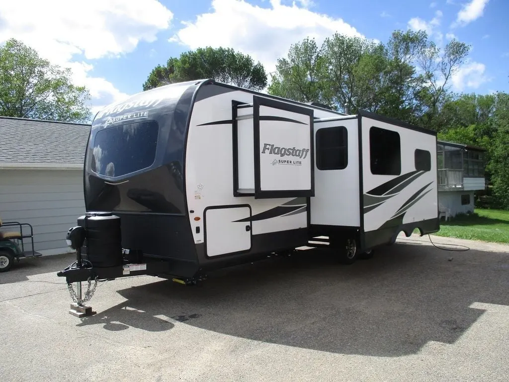 Side view of the New 2024 Forest River Flagstaff Super Lite 26RBWS Travel Trailer RV.