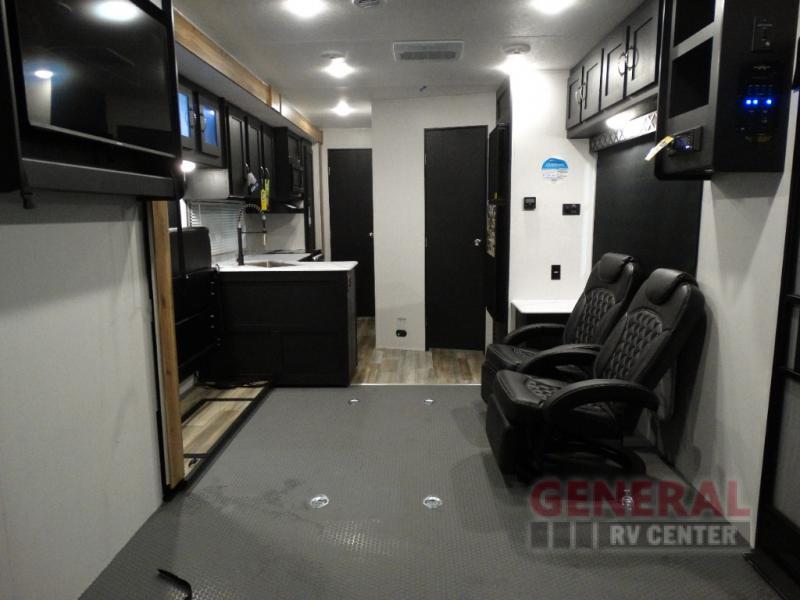 Interior view of the RV with a living space and a kitchen.