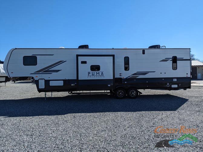 Side view of the New 2024 Palomino PUMA UNLEASHED 383DSS Fifth Wheel Toy Hauler RV.