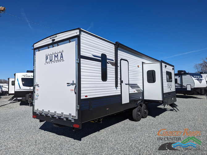 Side view of the New 2024 Palomino PUMA UNLEASHED 383DSS Fifth Wheel Toy Hauler RV.