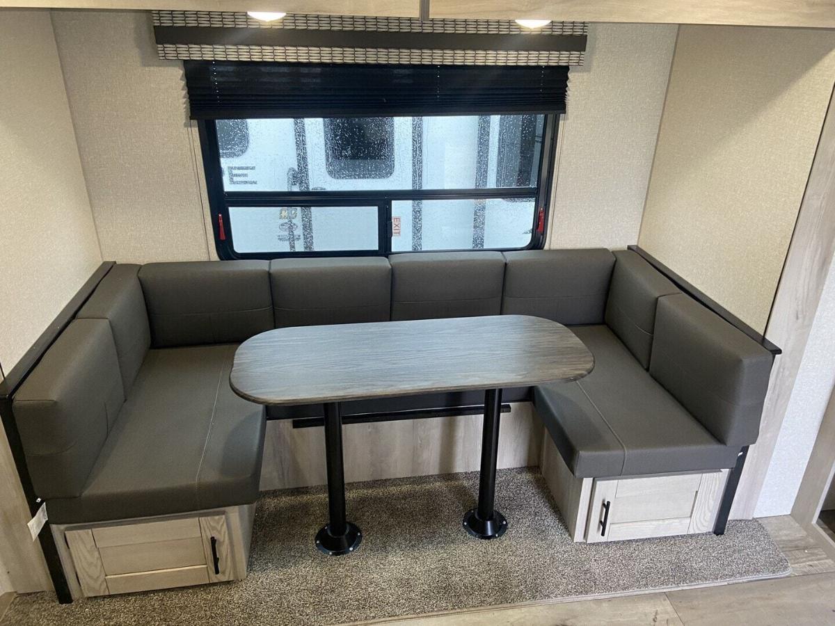 U-dinette with pull-out storage drawers.