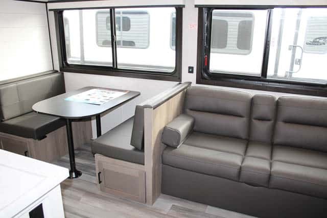 Dinette flanked by leather seats.