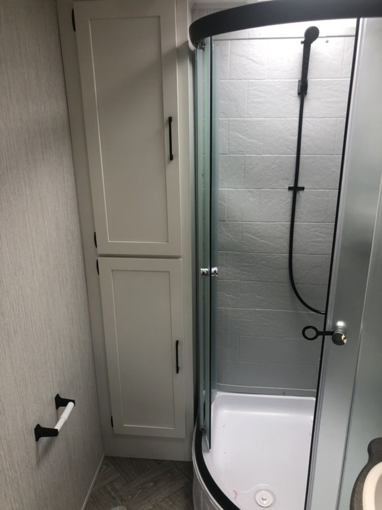 Bathroom with a walk-in shower.