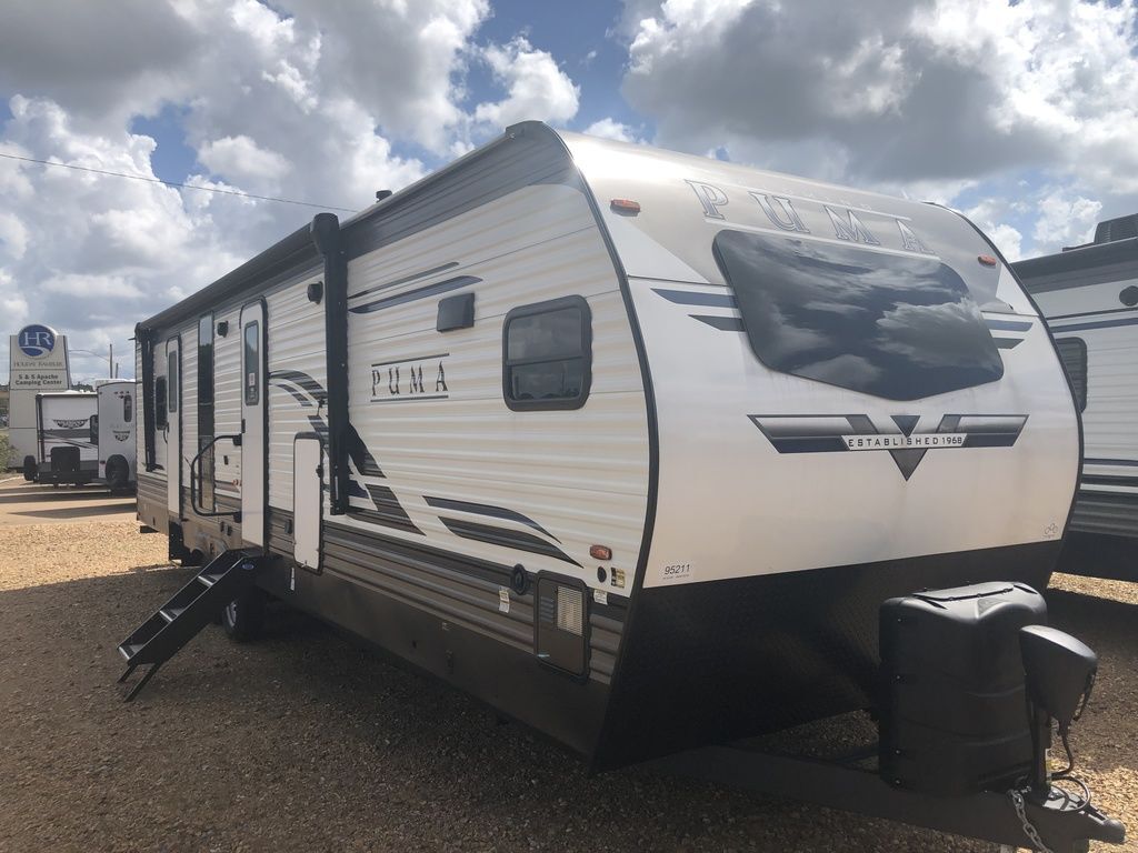 Side view of the New 2022 Palomino Puma 31FKRK Travel Trailer RV.