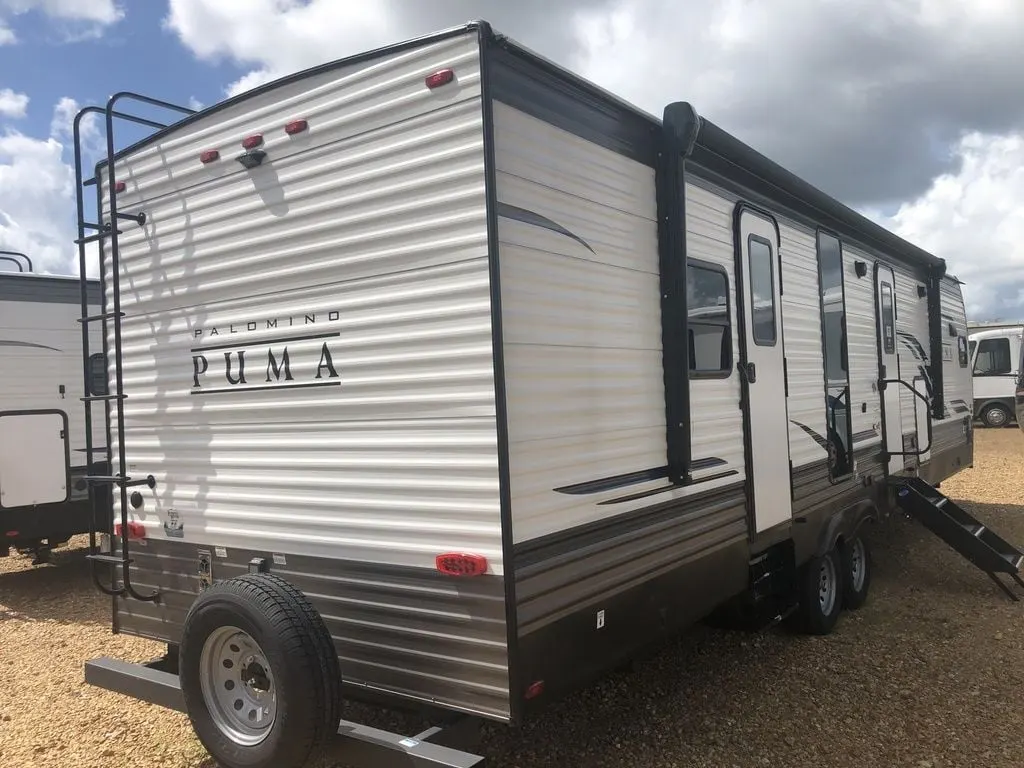 Side view of the New 2022 Palomino Puma 31FKRK Travel Trailer RV.