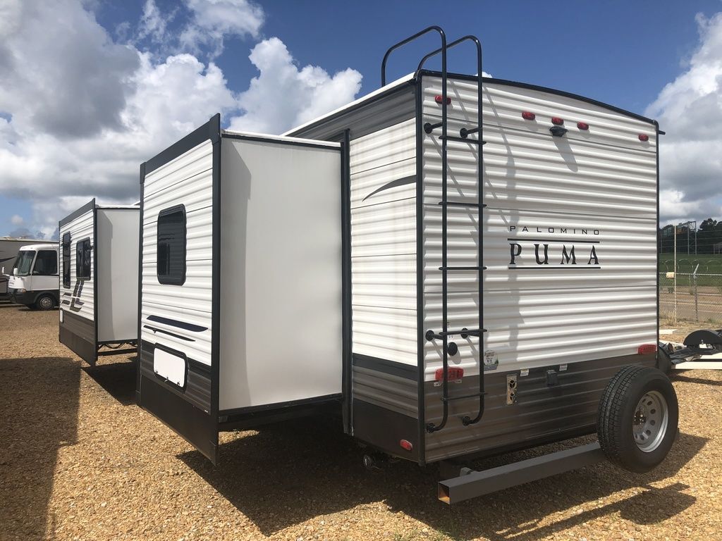 Side view of the RV with slide outs.