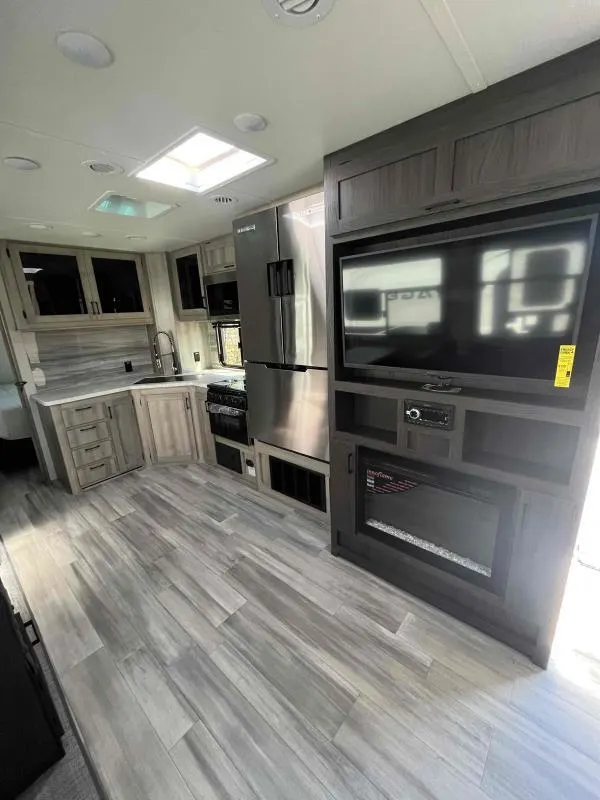 Kitchen flanked by the entertainment center.