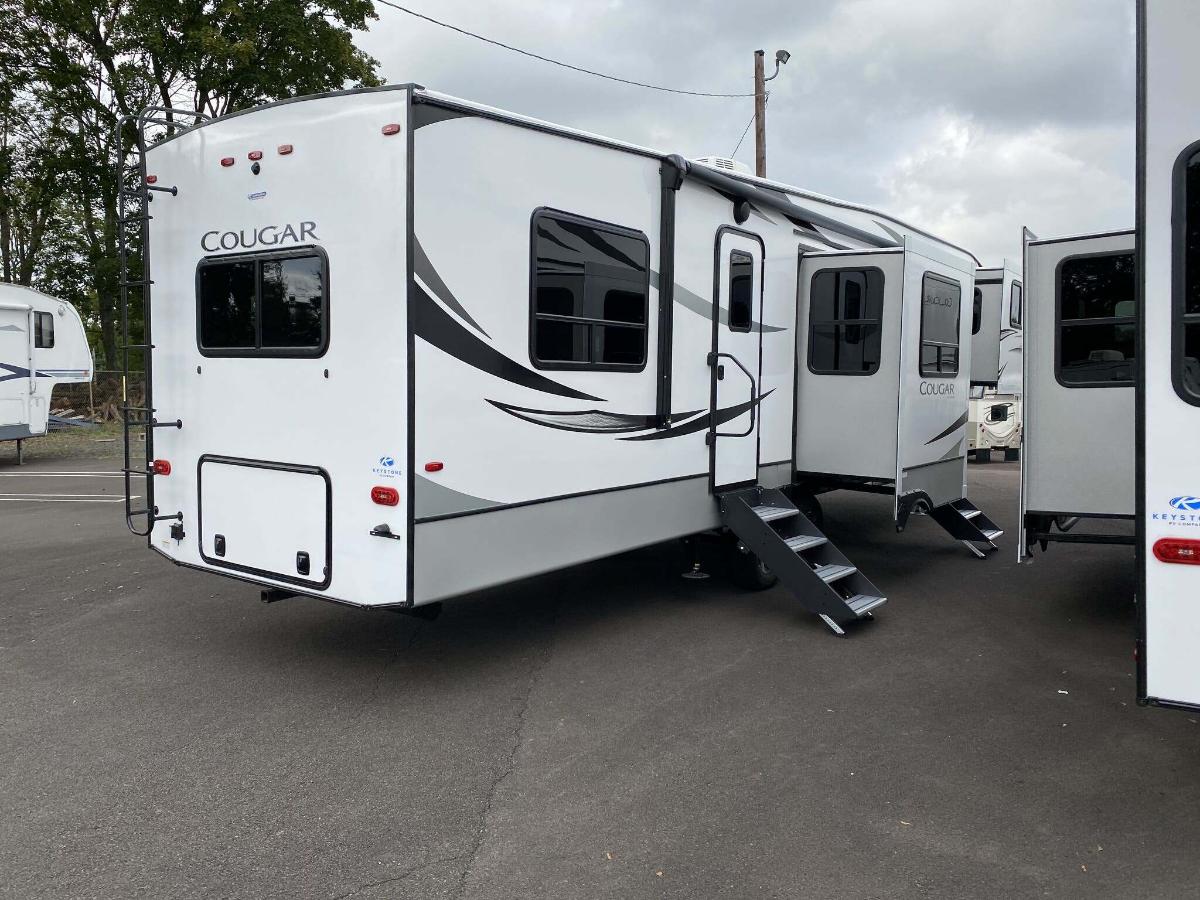 Side view of the New 2024 Keystone Cougar 354FLS Fifth Wheel RV.