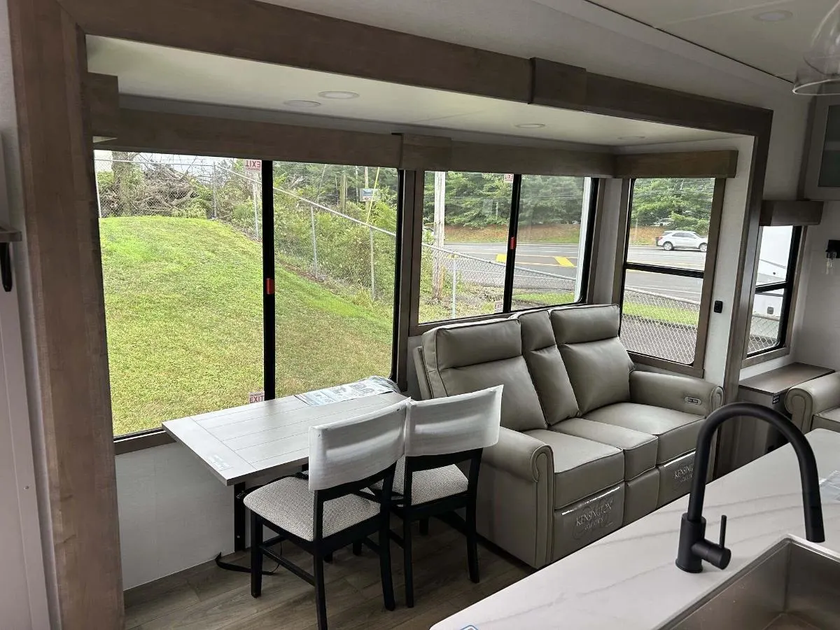 Dinette flanked by reclining chairs.