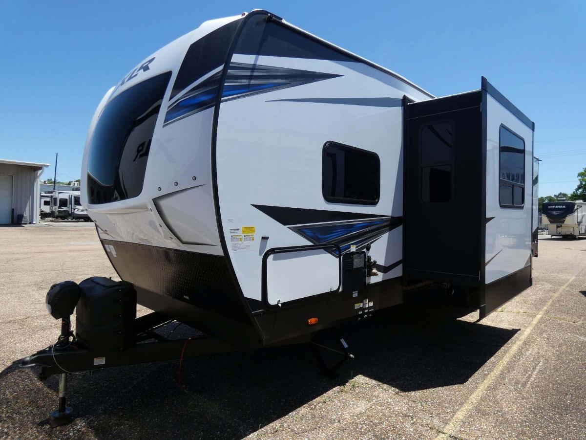 Side view of the New 2022 Forest River XLR Hyperlite 3212 Toy Hauler RV.