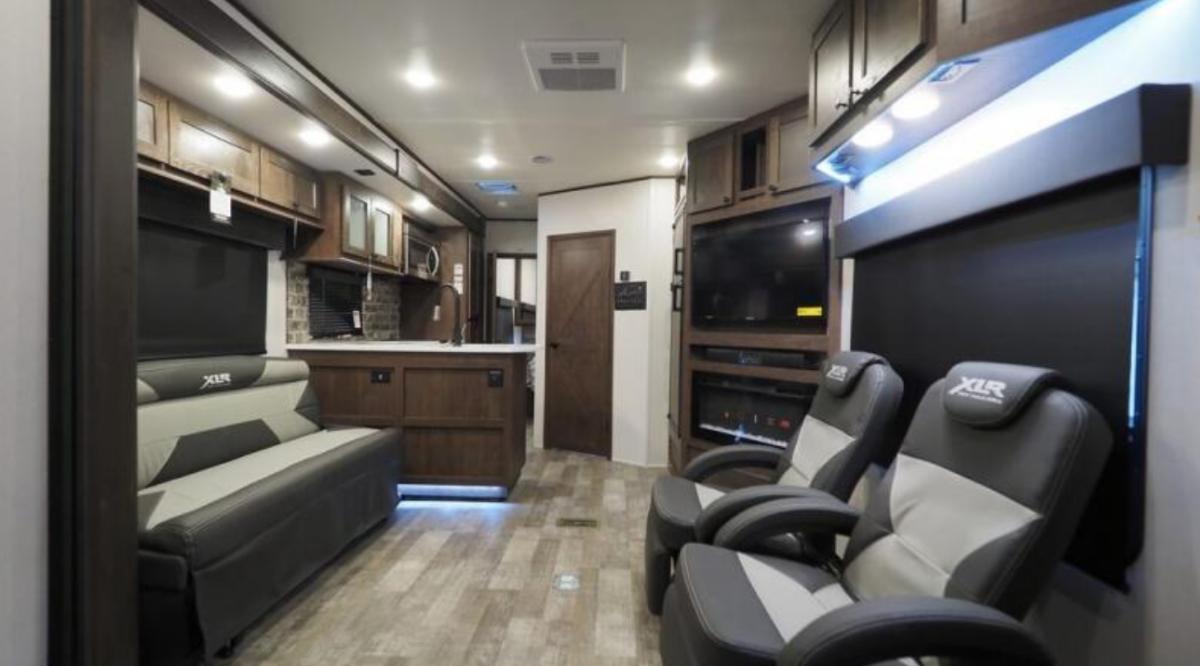 Interior view of the RV with a living space and a kitchen.