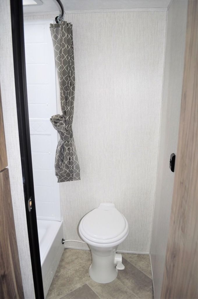 Bathroom with a toilet and a walk-in shower.