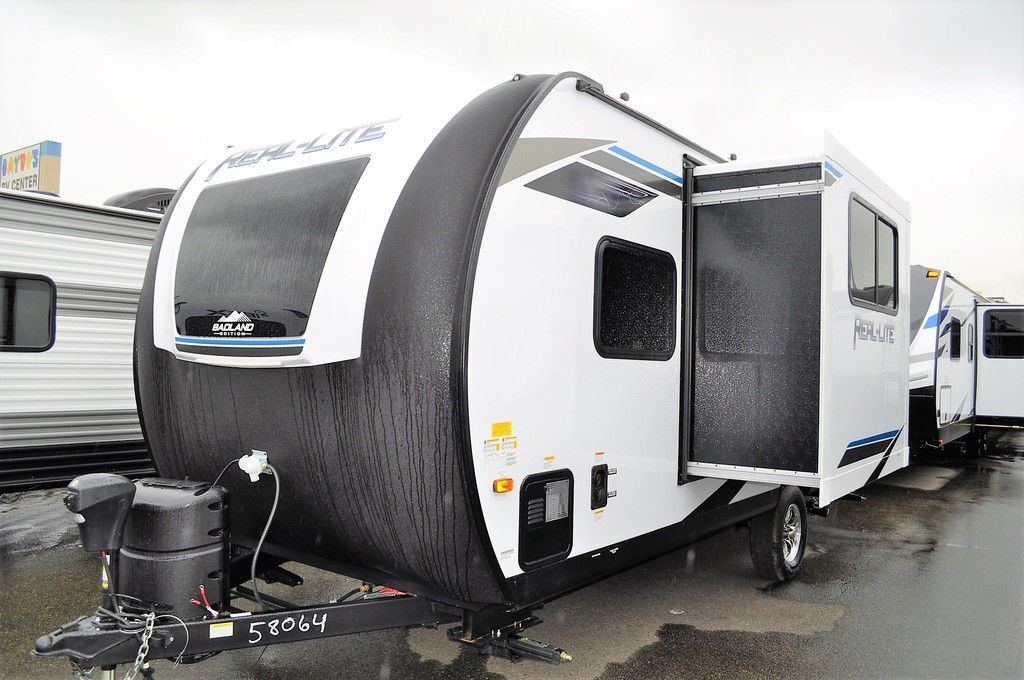 Side view of the New 2022 Palomino Real-Lite Mini RL189 Travel Trailer RV.