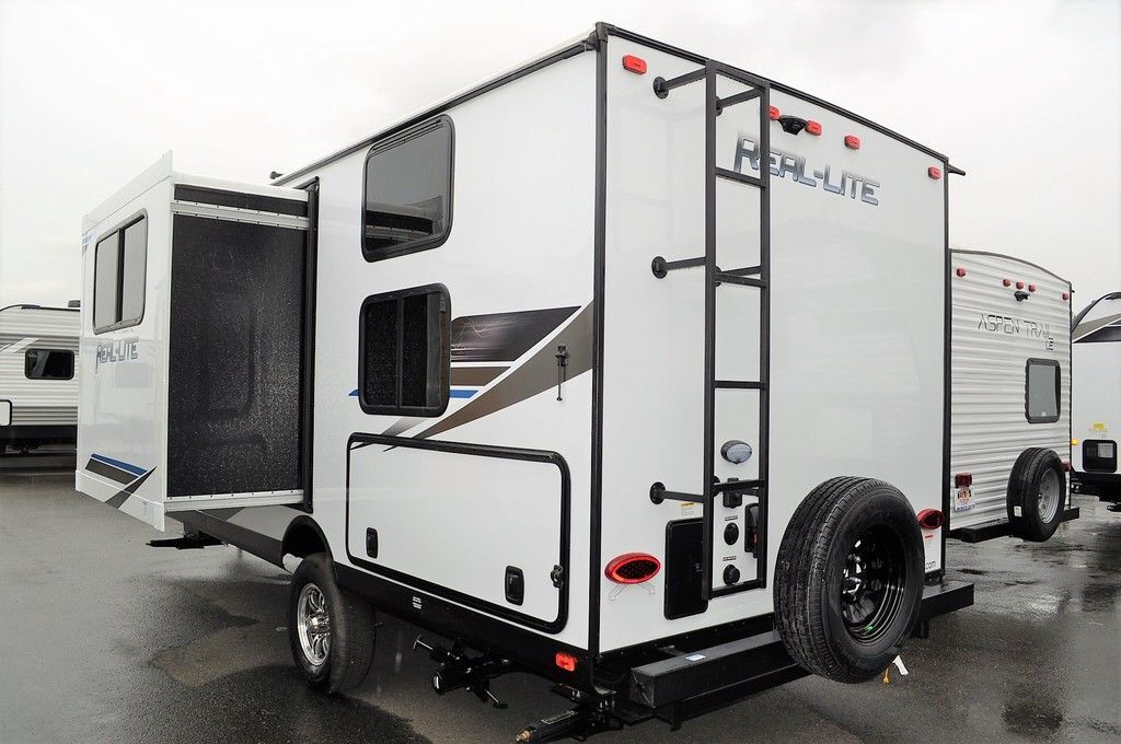 Side view of the New 2022 Palomino Real-Lite Mini RL189 Travel Trailer RV.